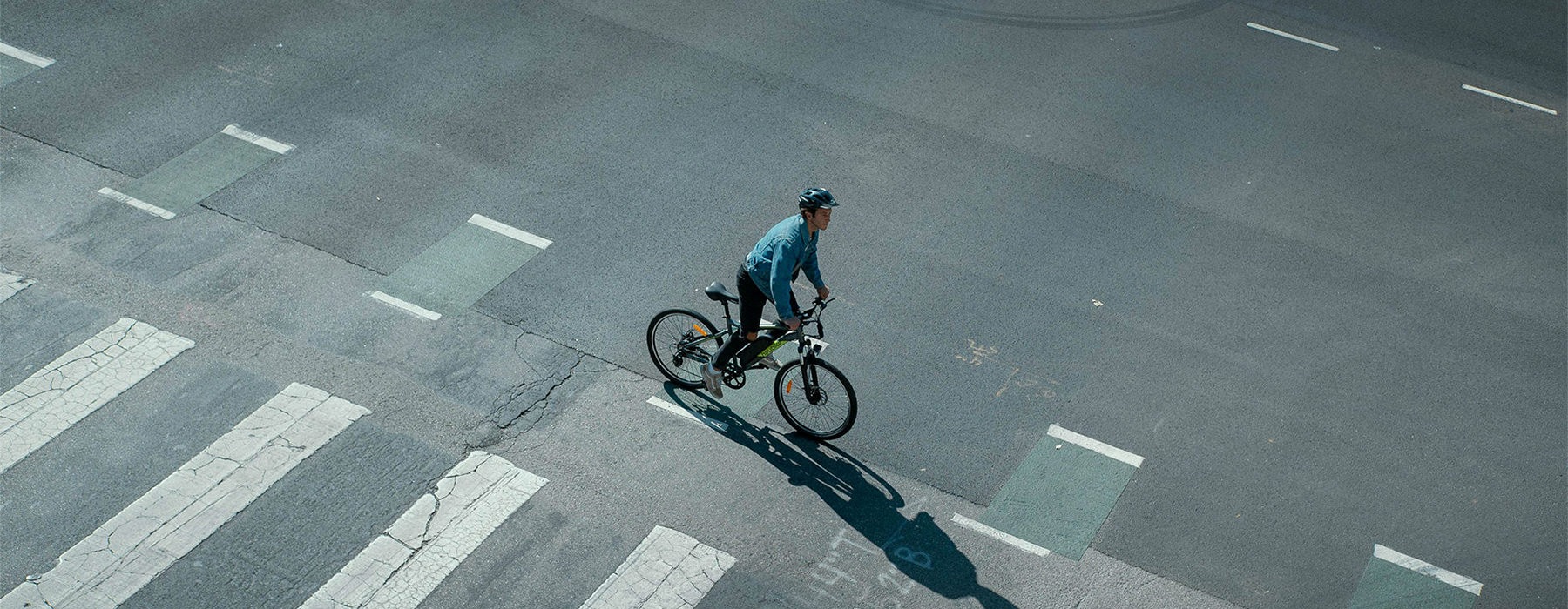 a person riding a bicycle on a street