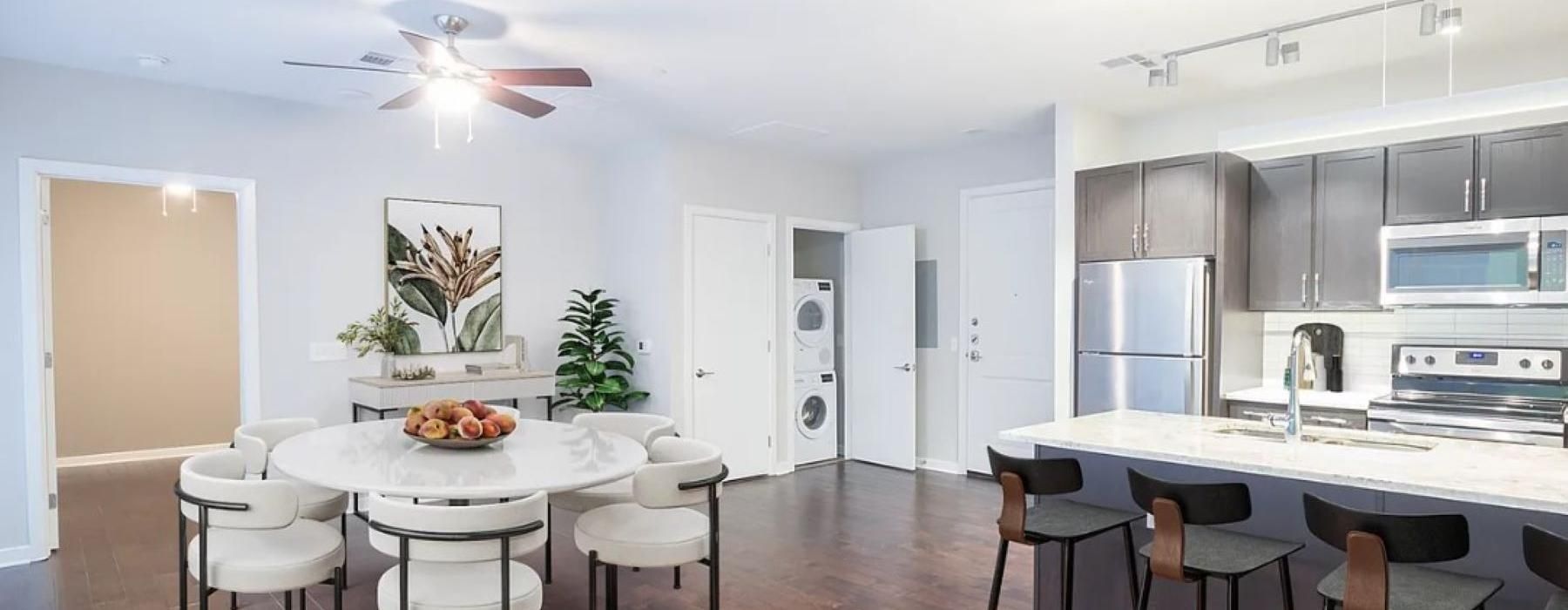 a kitchen with a table and chairs