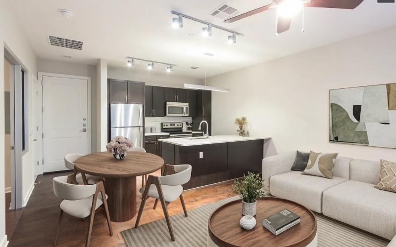 a living room with a table and chairs